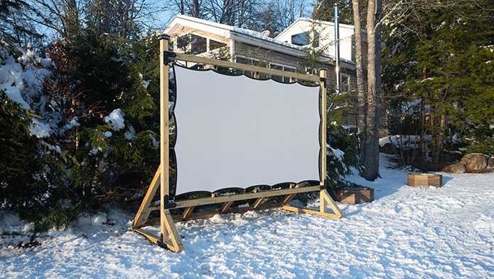 Grommet hole outdoor projection screen setup on a Timberline Outdoor Movie Theater Screen Frame.