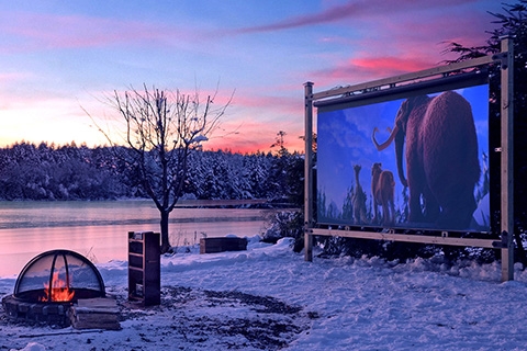 How to build an outdoor movie theater. Outdoor theater setup in front of a lake in the winter.