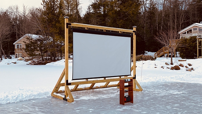 Timberline Movable Outdoor Movie Theater set up on a frozen lake in Maine.